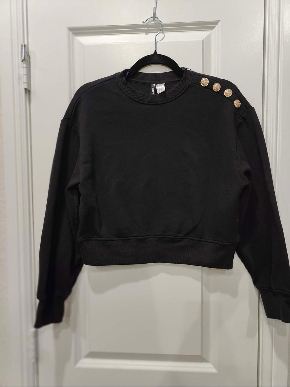 Divided Black Crewneck Sweater with Gold Shoulder Buttons